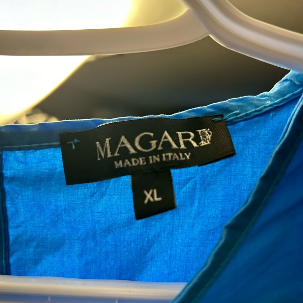 This beautiful blue dress was made in Italy.